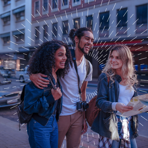 image of three people walking and laughing, two boys and one girl